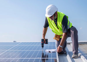 A contractor installing solar on the roof