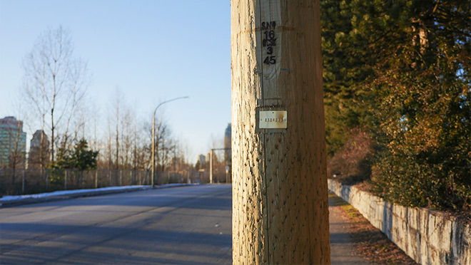 Photo of a BC Hydro wooden pole and its Pole ID