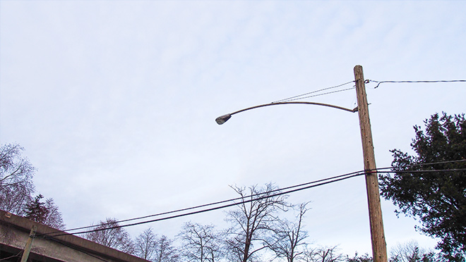 Photo of a street light attached to a BC Hydro wooden pole