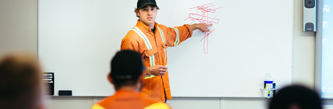 Power line technician in classroom training apprentices Power line technician in classroom training apprentices