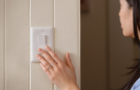Woman turning off the lights Woman turning off the lights