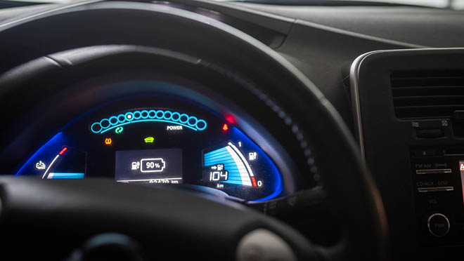 Close up of illuminated dashboard in electric car. Close up of illuminated dashboard in electric car.